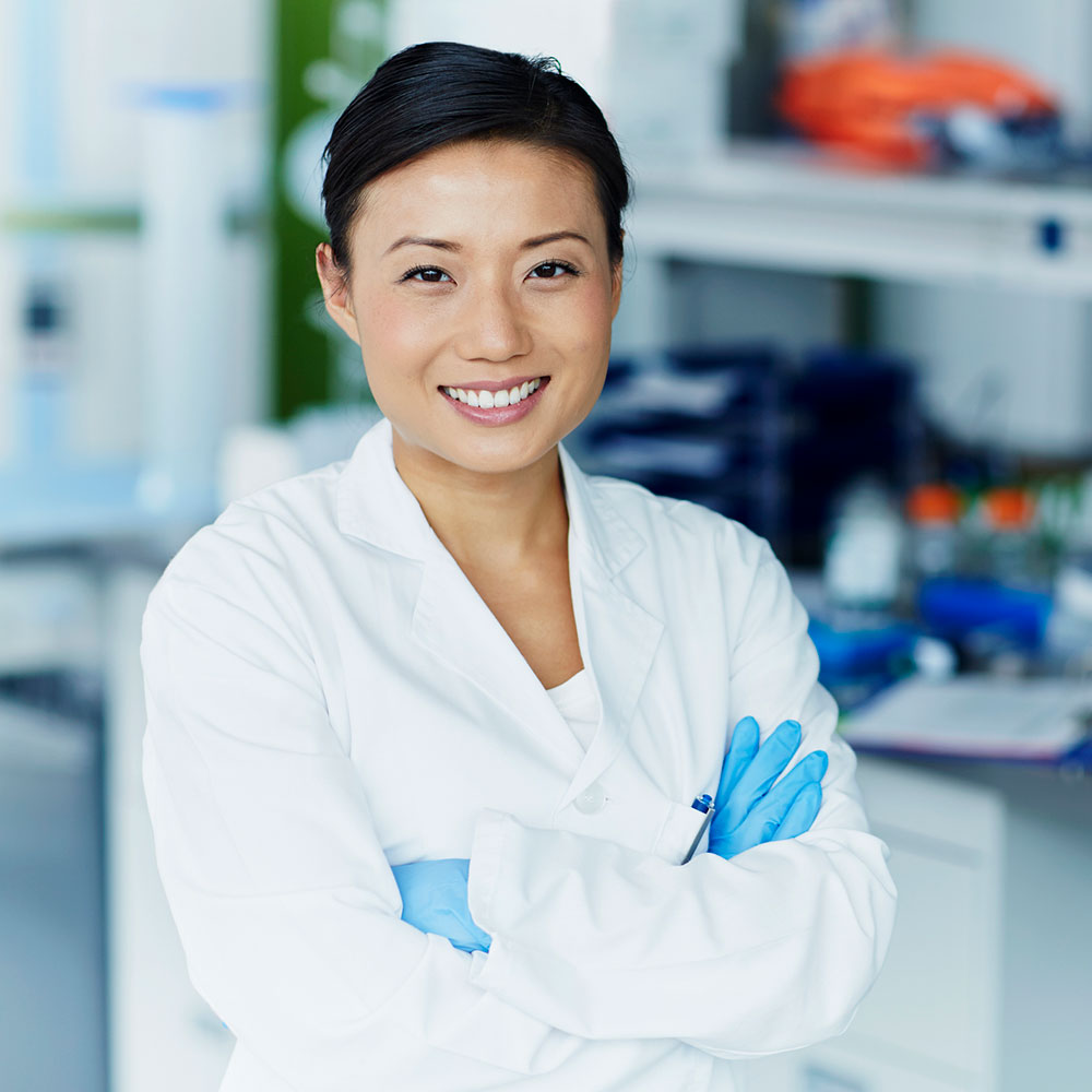 Portrait of confident female scientist in modern laboratory