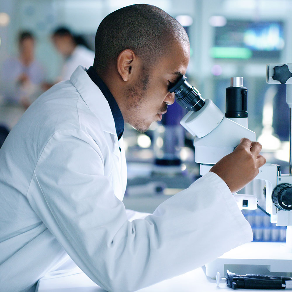 Side view of male biologist or chemist working on a medical development in a laboratory